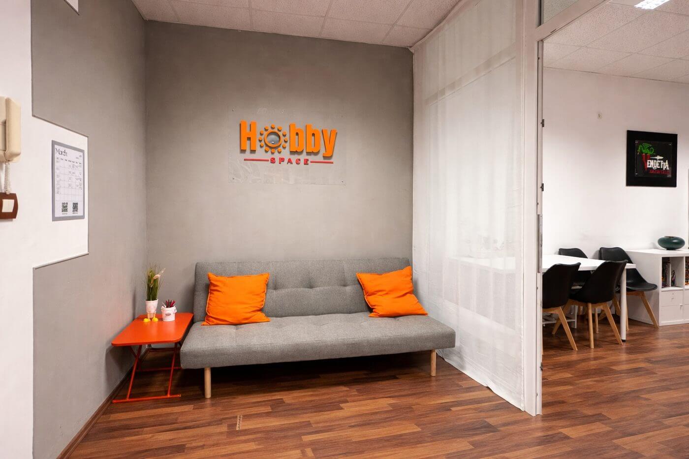 Hobby Space interior with logo on wall