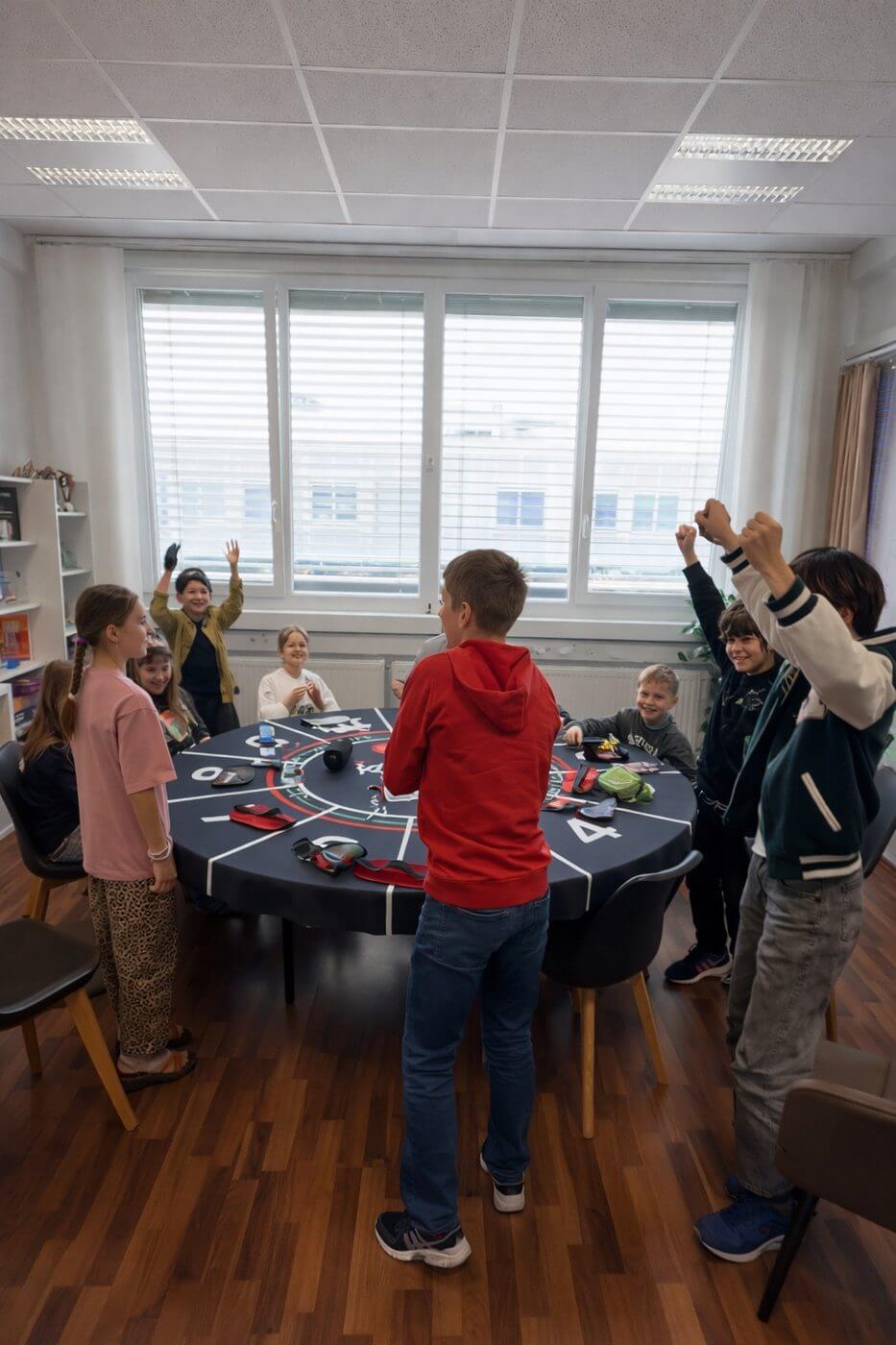 Kids celebrating at mafia table